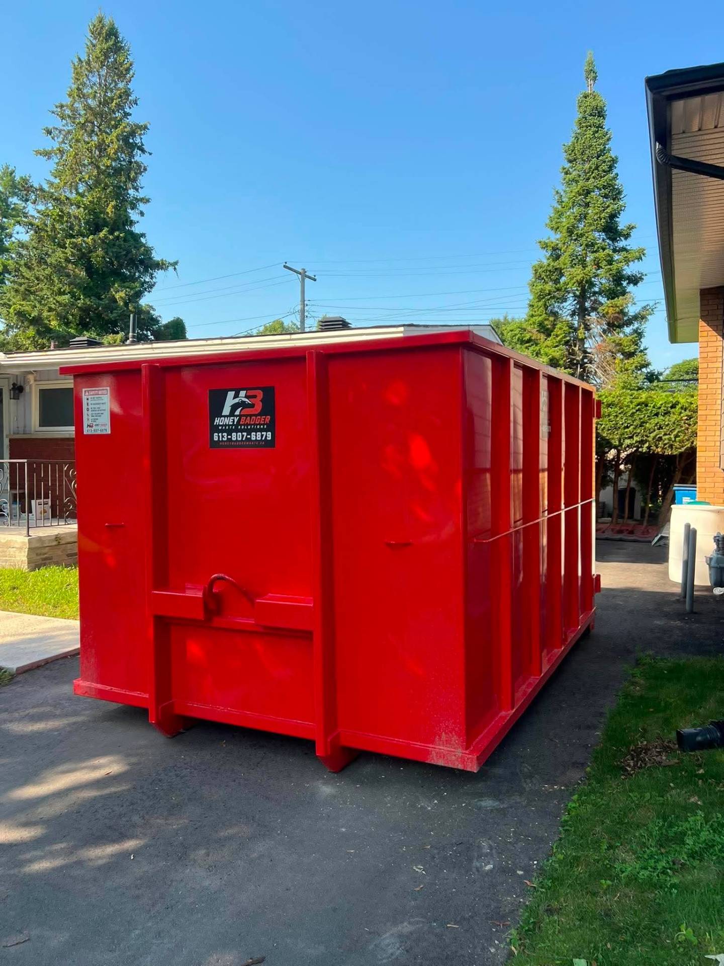 20 yard bin dropped on a residential driveway for a renovation — serving Rockland, Ontario
