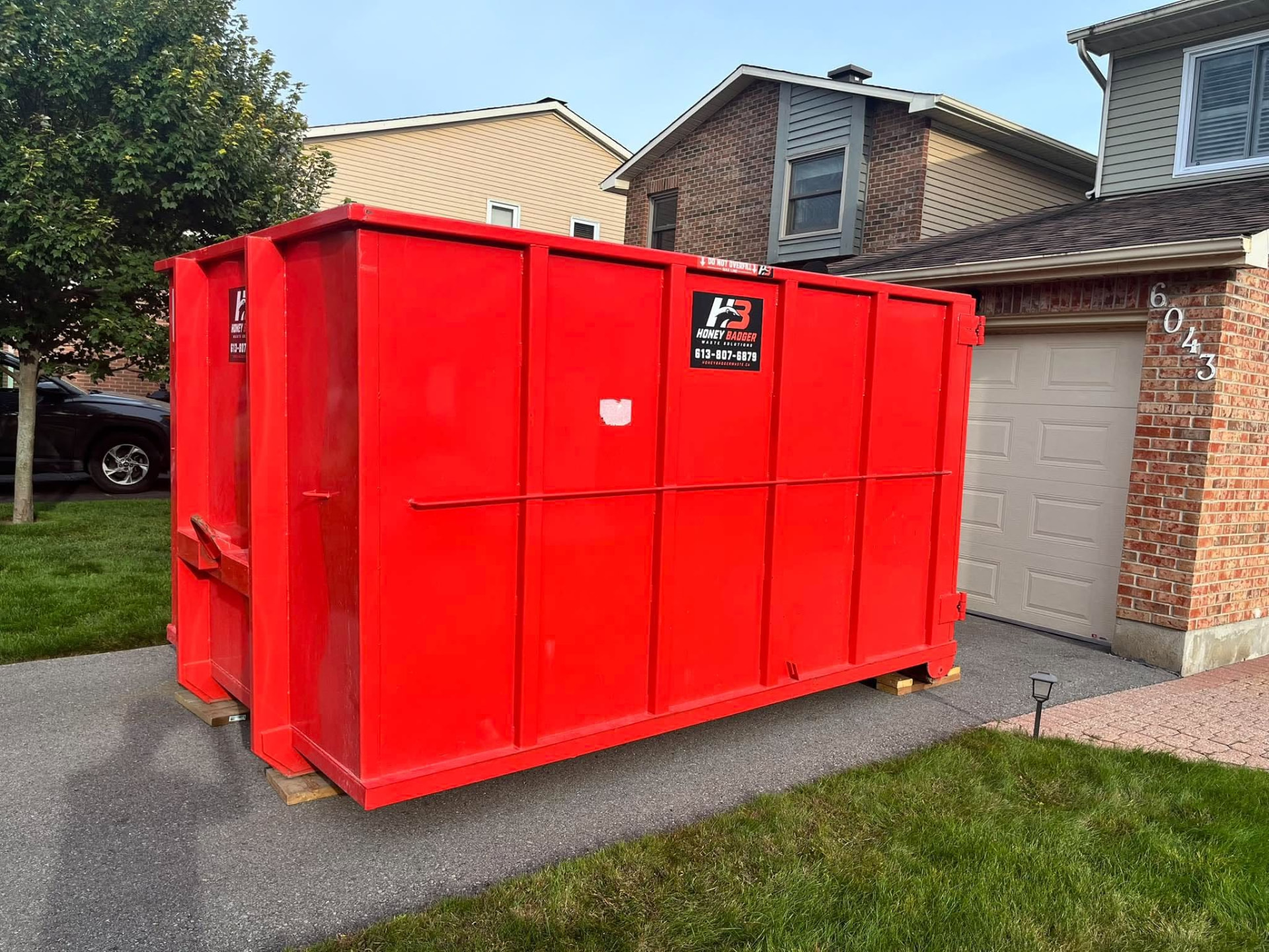 20 yard bin dropped on a residential driveway for a renovation — serving Gatineau, Quebec
