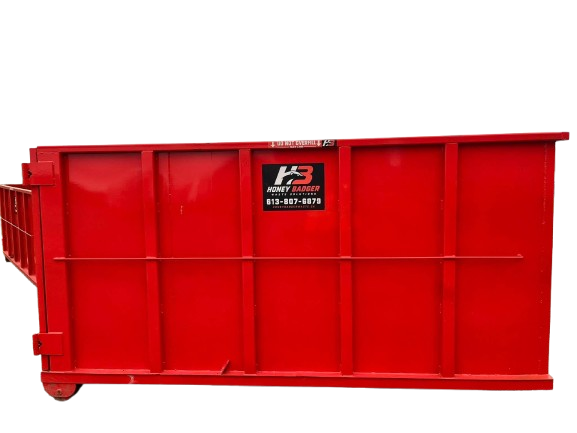 Side view of a red Honey Badger 14 yard dumpster rental bin